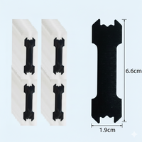 Lot de clips/écarteurs nasaux noirs posés sur fond clair ; vue rapprochée d’une pièce avec dimensions indiquées : 6,6 cm × 1,9 cm — format compact pour application nasale.